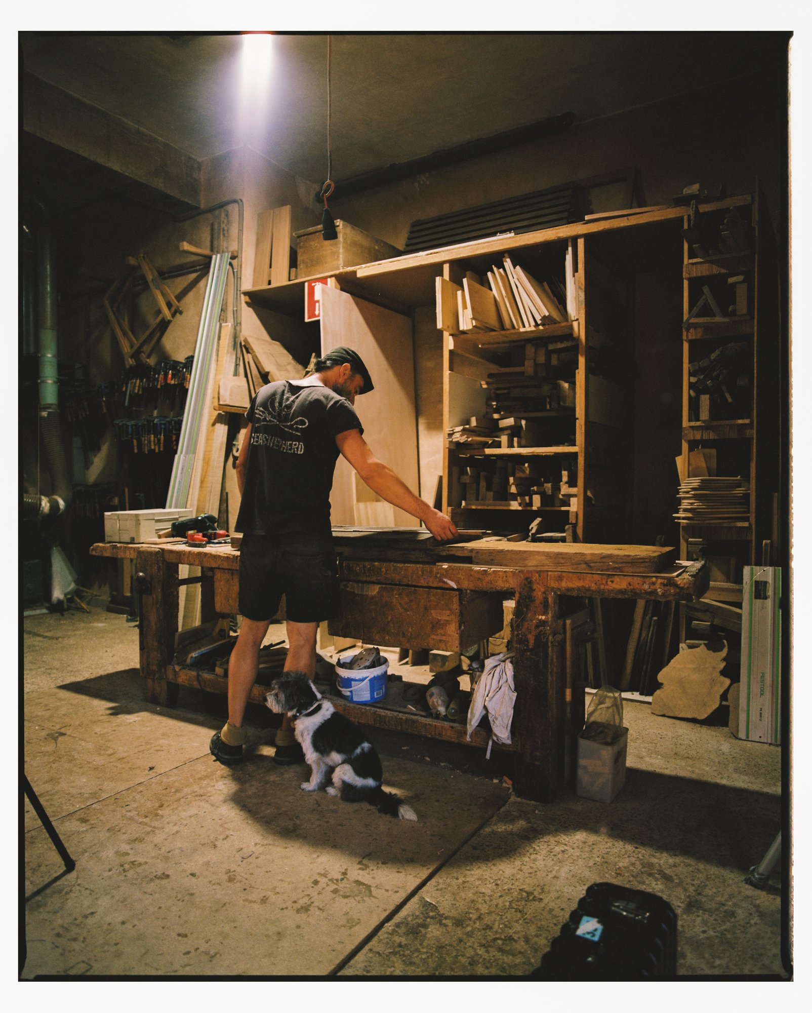 A finished piece being sanded and oiled at the bench.